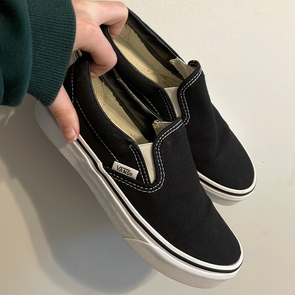 Women’s size 6 (men’s 4.5) black slip on vans.